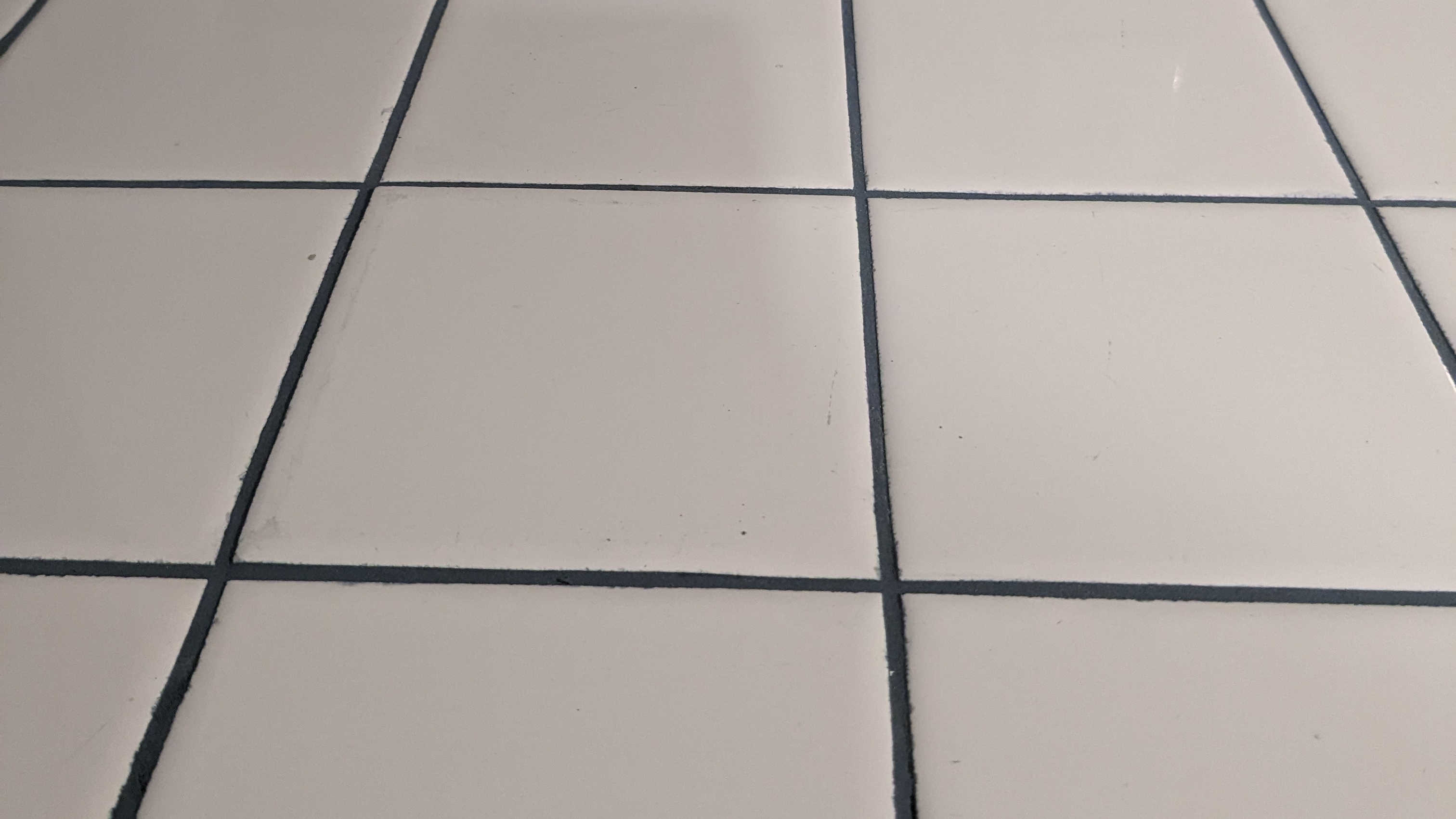 New blue grout on tiled kitchen countertops