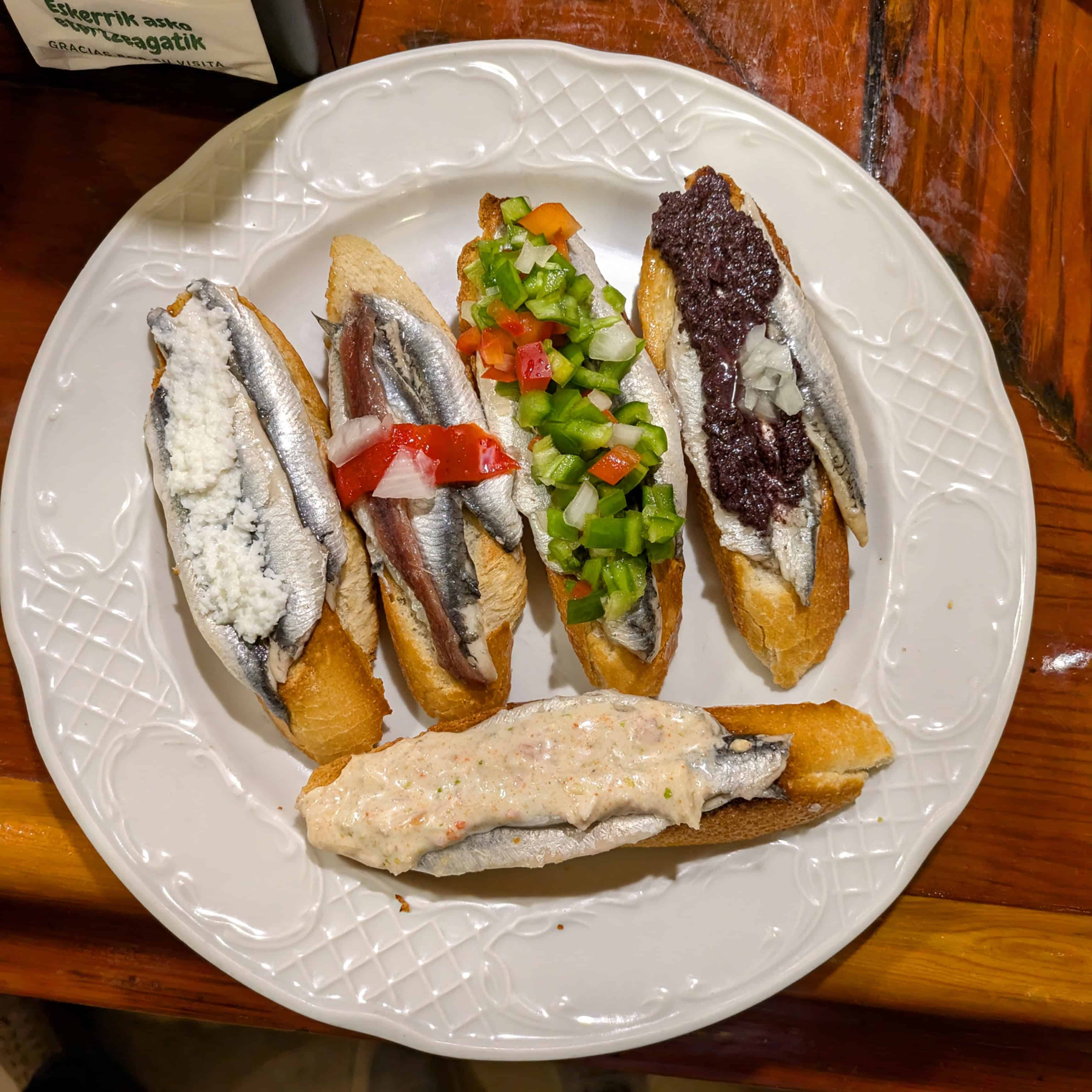 Variety of anchovy pintxos at Bar Txepetxa